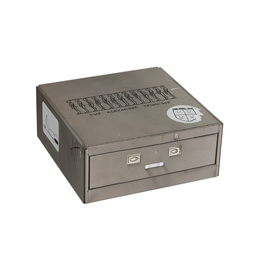Front and side view of a grey Rex Orange County paper box featuring a ‘The Alexander Technique’ print on the top.