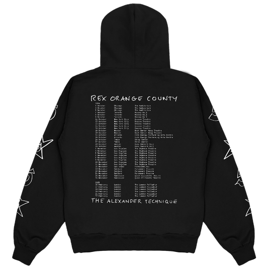 Back view of a black relaxed-fit unisex hoodie featuring Rex Orange County 2024/2025 tour dates printed across the back.