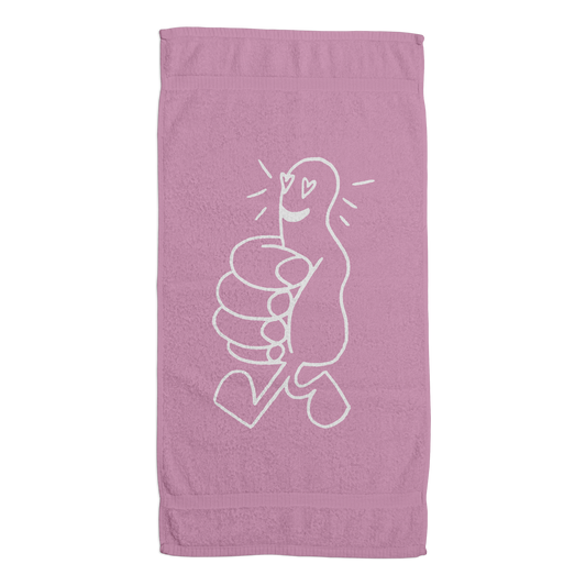 Front view of a pink premium beach towel featuring a white jacquard design of a thumbs-up emoji with heart eyes.