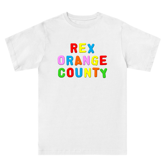 Front view of a white unisex regular-fit short-sleeve T-shirt featuring a colourful ‘Rex Orange County’ print across the front, with each letter in a different colour. Made from 100% cotton.